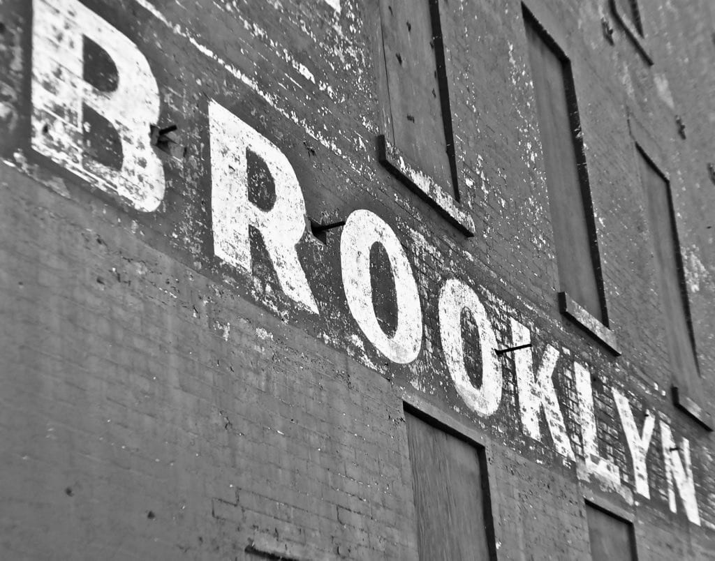 A black and white photo of the brooklyn sign.