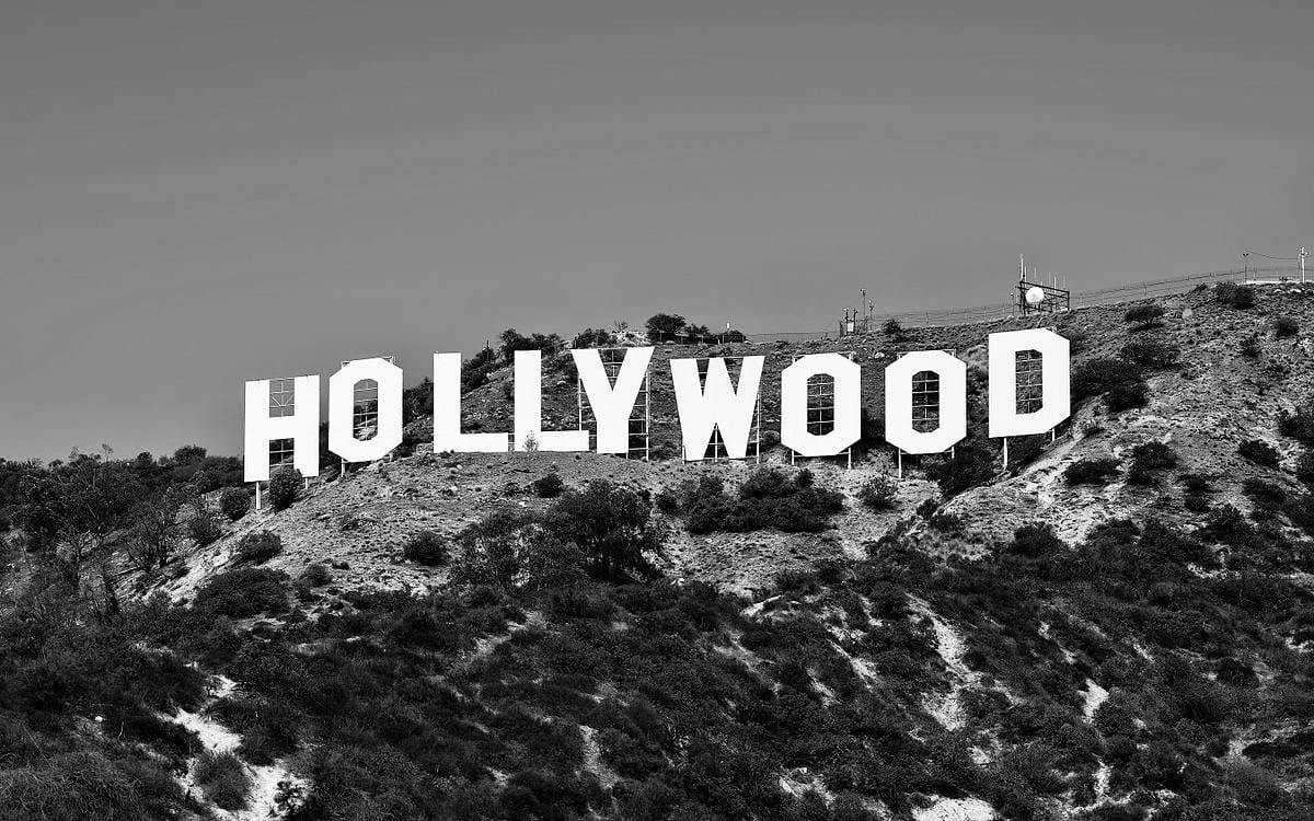 A black and white photo of the hollywood sign.