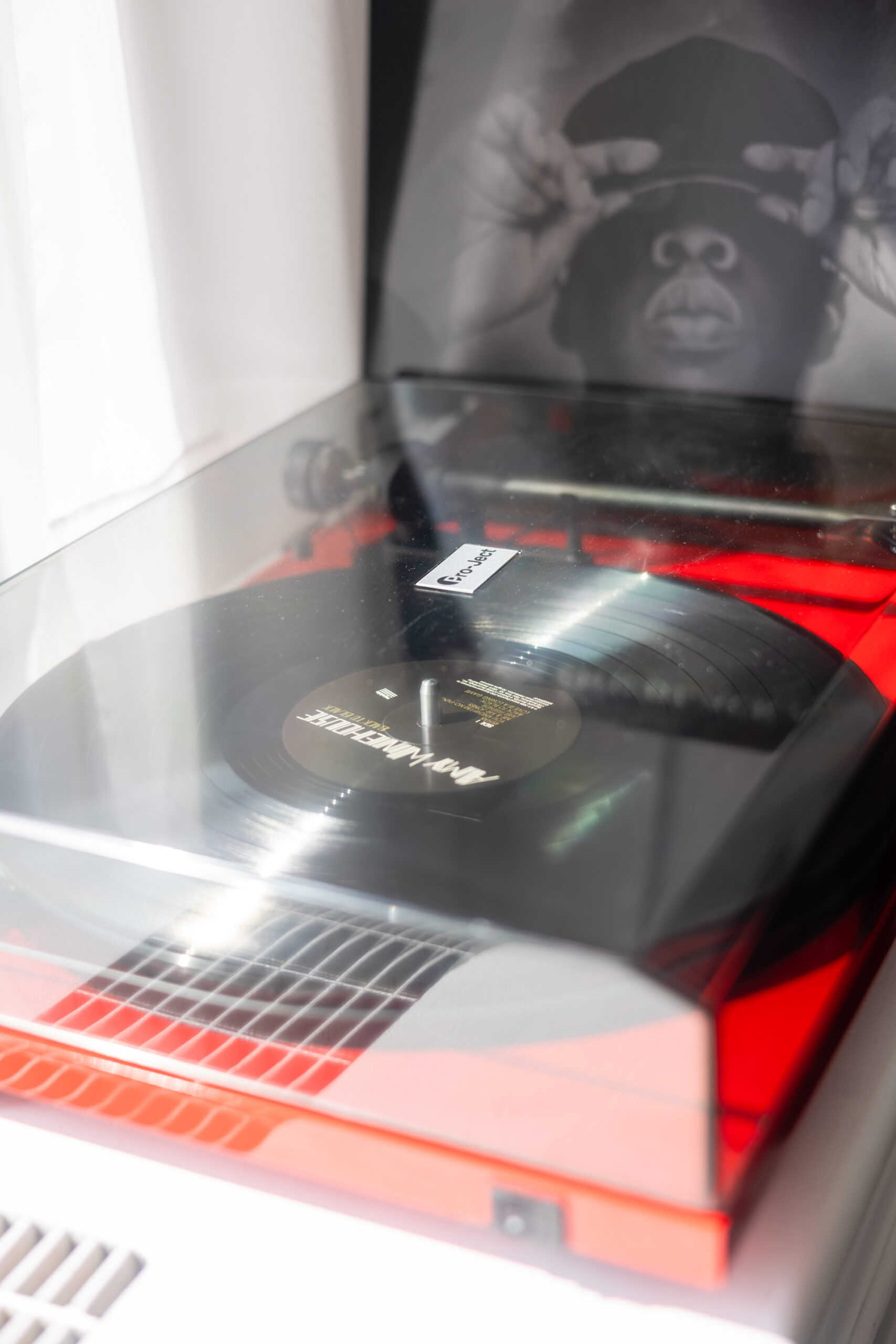 A record player with the lid open.