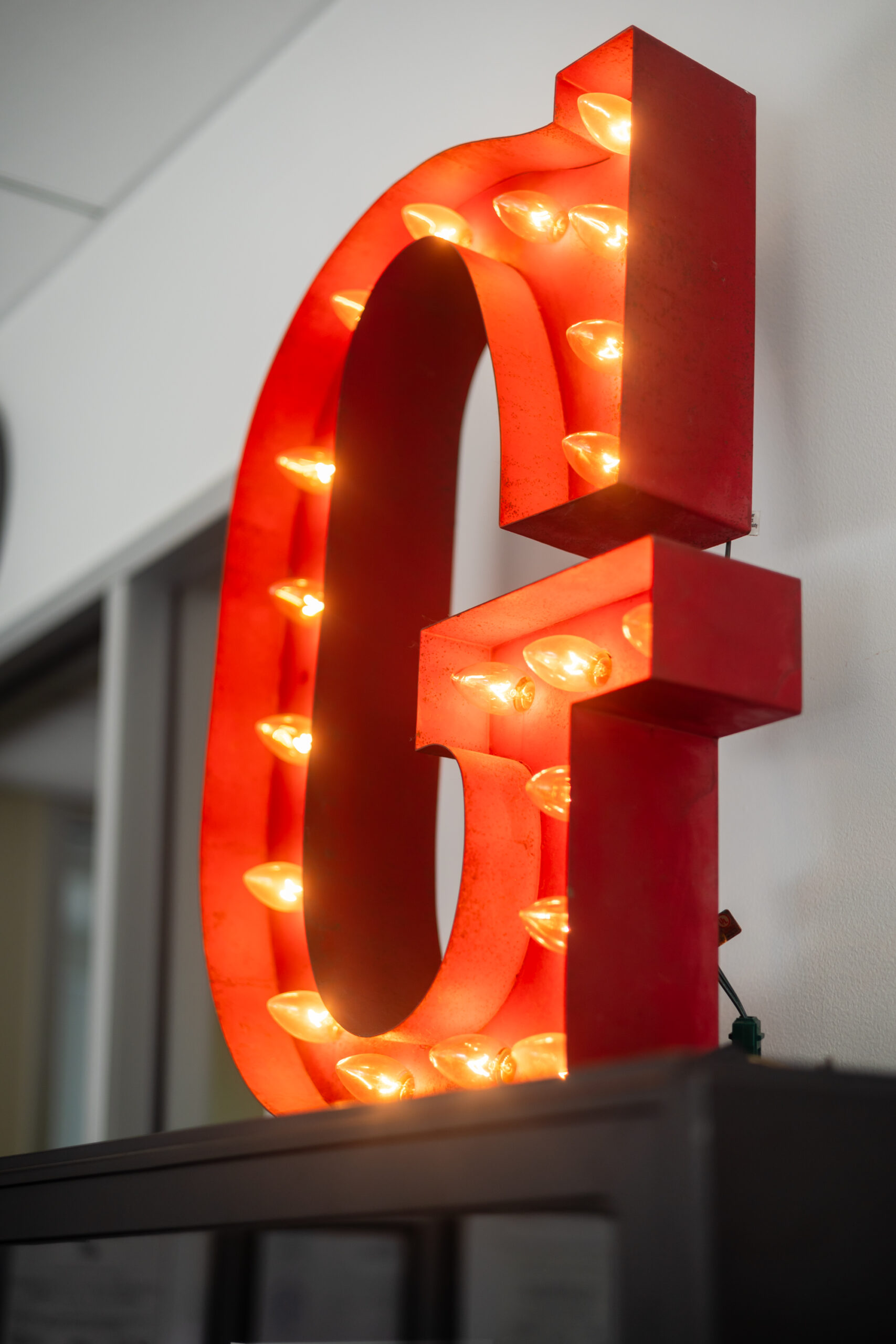 A red letter g with lights on it